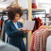 Fashion retailer using a laptop to manage product and supplier information