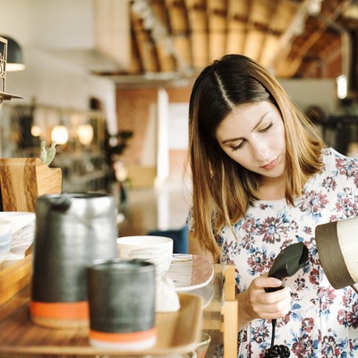 Woman in shop counting